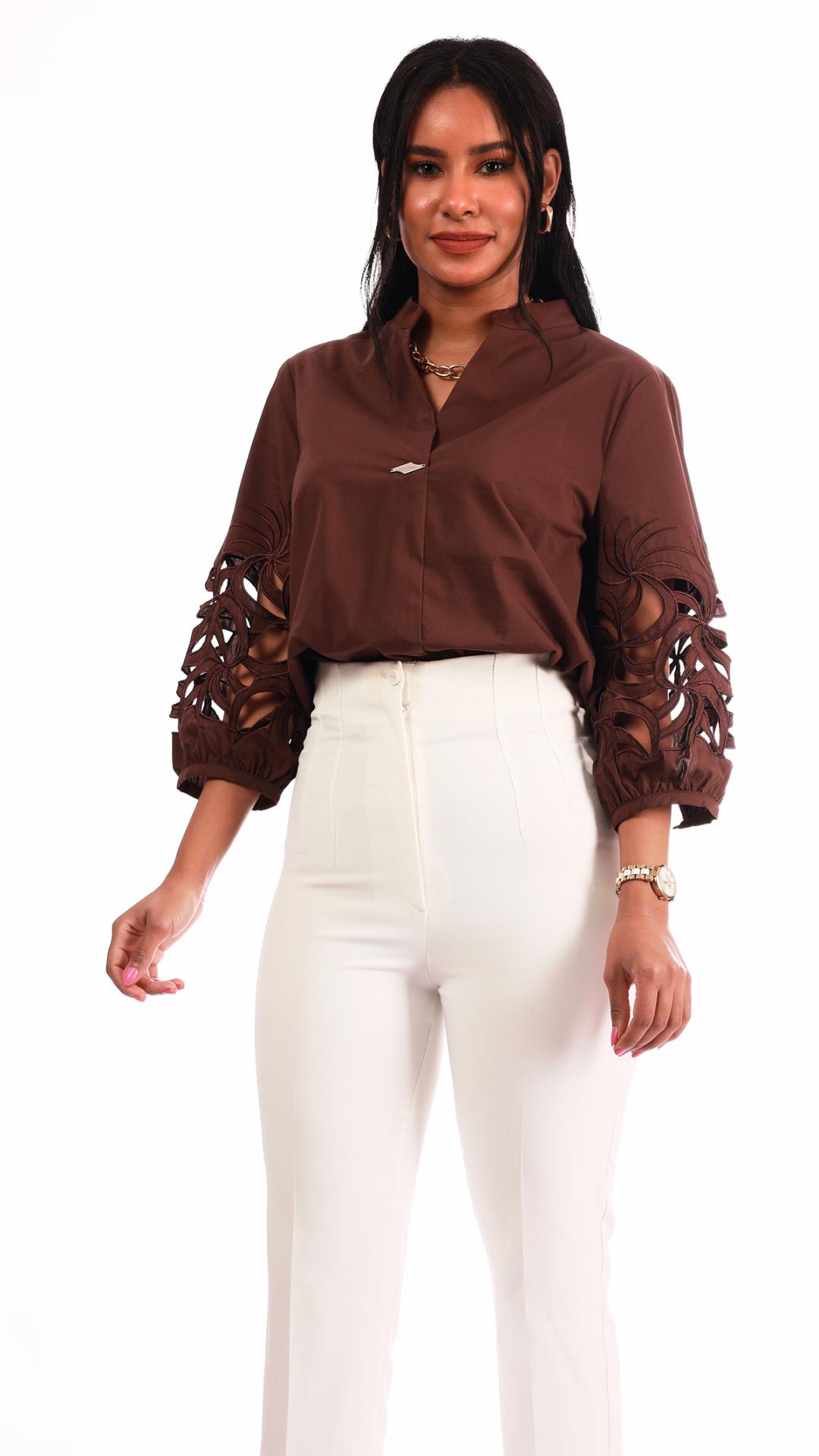 V-neck blouse with a brooch on the chest